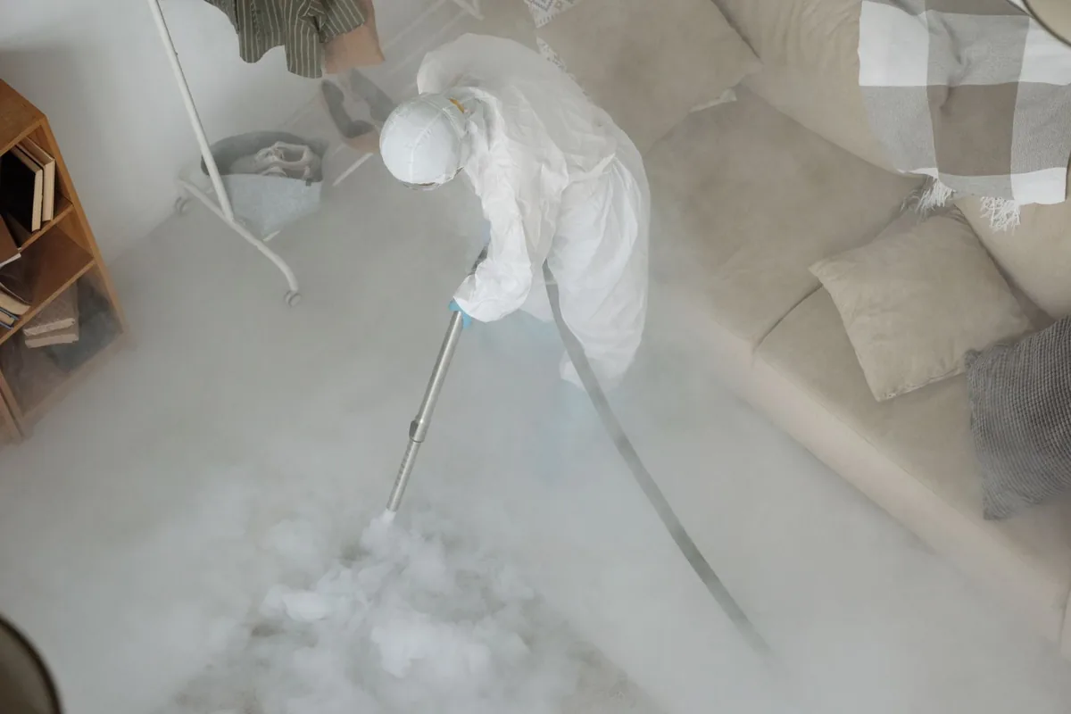 Biohazard cleanup technician in protective equipment, Port Monmouth, NJ
